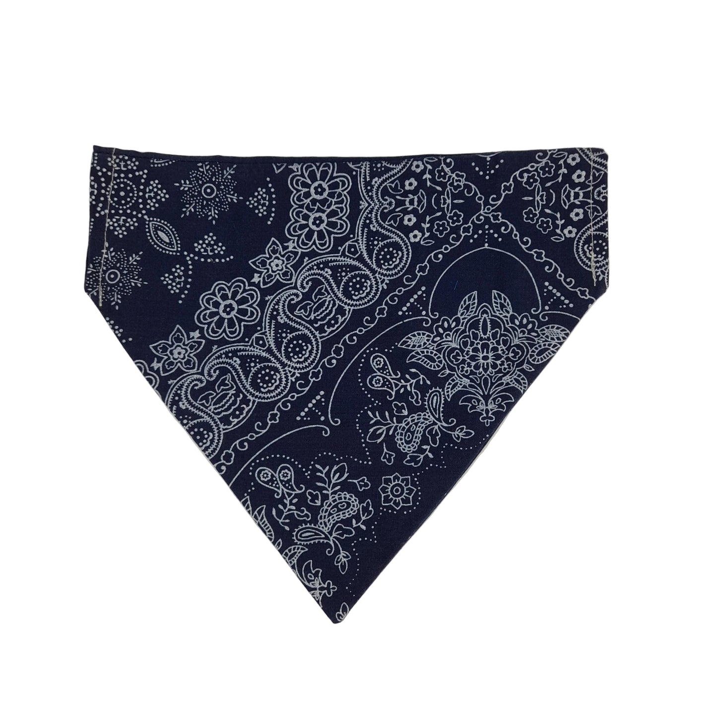 A navy blue bandana with a white paisley and floral pattern, folded into a triangle and displayed on a light background.