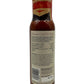 Bottle of sauce with label on a white background
